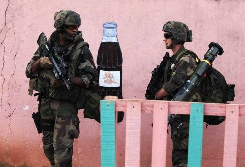 French soldiers take positions during a daytime patrol in Bangui