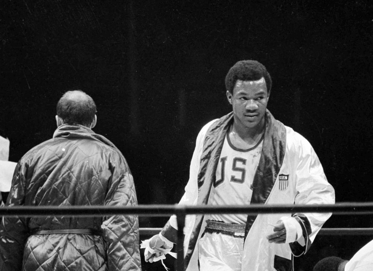 FILE - Heavyweight boxer George Foreman is seen during his bout with Russia's Iones Chepulis during their Olympic finals in Mexico City, Oct. 27, 1968. Foreman captured the gold medal. (AP Photo, File). EDITORIAL USE ONLY/ONLY ITALY AND SPAIN