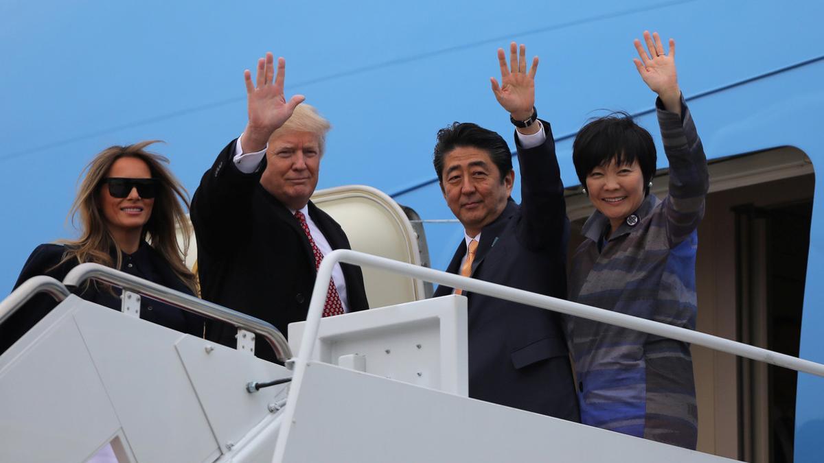 U.S. President Donald Trump and his wife Melania (L) wave with Japanese Prime Minister Shinzo Abe (2ndR) and his wife Akie Abe while boarding Air Force One as they depart for Palm Beach, Florida, at Joint Base Andrews, Maryland, U.S.
