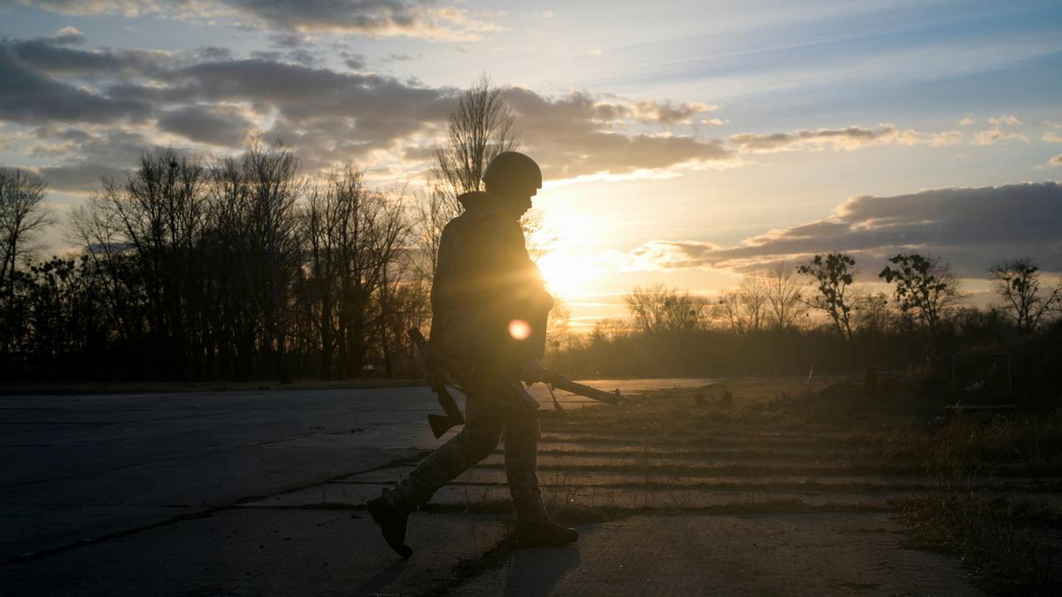 A Ukrainian serviceman takes position at the military airbase Vasylkiv in the Kyiv region