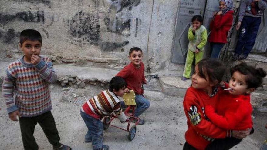Niños jugando ayer en Damasco.