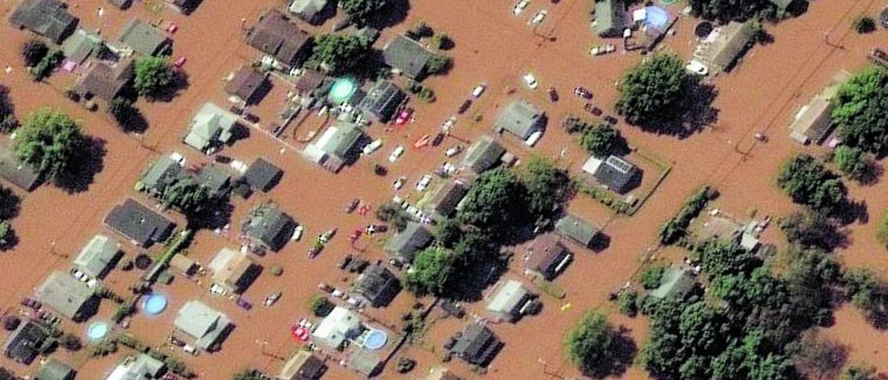 La localidad de Manville, en Nueva Jersey (EEUU), inundada por los coletazos de la tormenta tropical ‘Ida’, el pasado 2 de septiembre. | | MAXAR TECHNOLOGIES