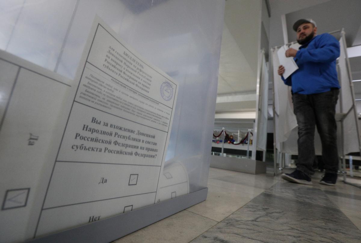 People vote during a referendum on the joining of Russian-controlled regions of Ukraine to Russia, in Sevastopol