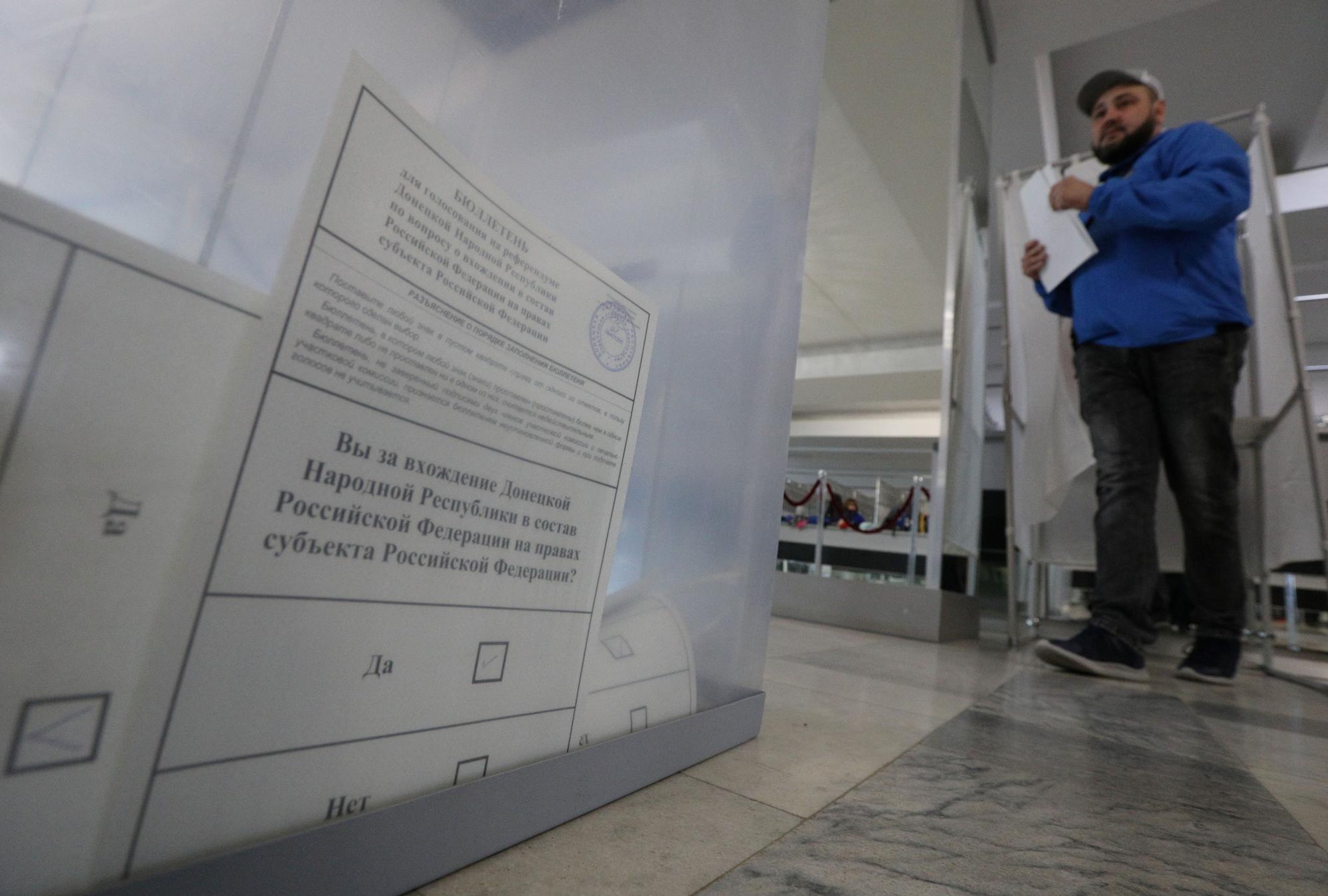 People vote during a referendum on the joining of Russian-controlled regions of Ukraine to Russia, in Sevastopol