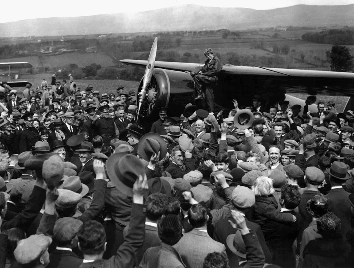 FILE--A crowd cheers for Amelia Earhart, the first woman to fly across the Atlantic alone, as she boards her single-engine Lockheed Vega airplane in Londonderry, Northern Ireland, for the trip to London May 22, 1932. Earhart vanished mysteriously over the Pacific during her attempted round-the-world flight in 1937. (AP Photo/File) FILE--A crowd cheers for Amelia Earhart, the first woman to fly across the Atlantic alone, as she boards her single-engine Lockheed Vega airplane in Londonderry, Northern Ireland, for the trip to London May 22, 1932. Earhart vanished mysteriously over the Pacific during her attempted round-the-world flight in 1937. (AP Photo/File)