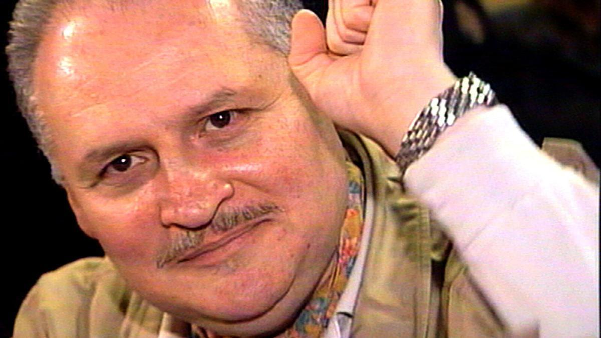 FILE PHOTO: Ilich Ramirez Sanchez, better known as &quot;Carlos the Jackal&quot;, raises his fist as he appears in court in Paris