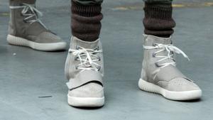 FILE PHOTO: A model wears a pair of Adidas Yeezy 750 Boost shoes designed by Kanye West as part of his Fall/Winter 2015 partnership line with Adidas at New York Fashion Week February 12, 2015. REUTERS/Lucas Jackson (UNITED STATES - Tags: FASHION SOCIETY)/File Photo. NARCH/NARCH30