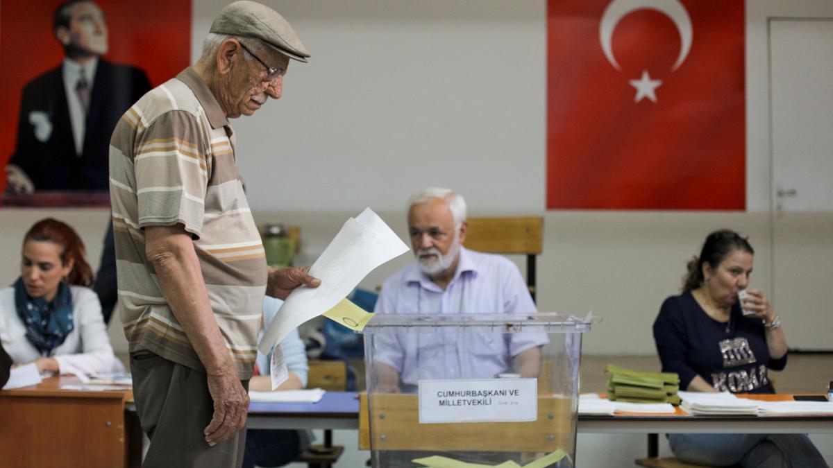 A man casts his ballot for Turkey's presidential and parliamentary elections at a polling station in Ankara