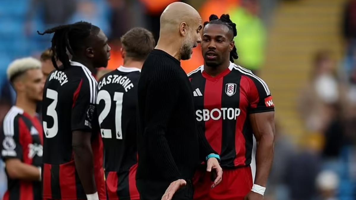 Guardiola junto a Adama tras el partido del City y el Fulham
