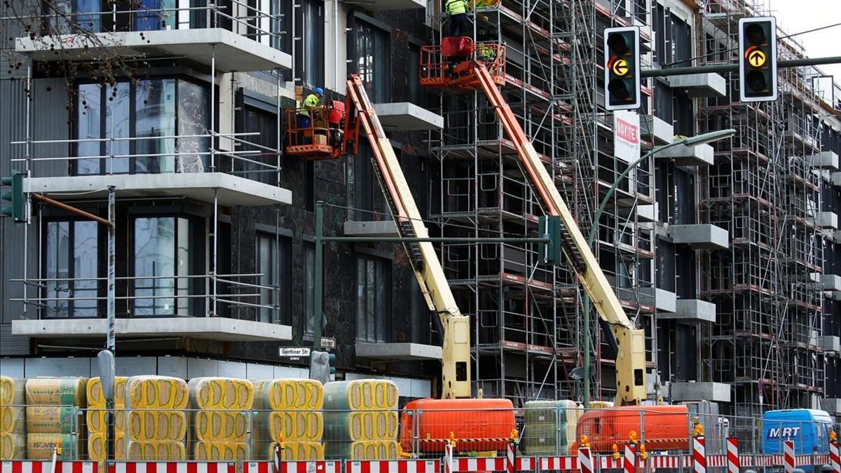 Workers are seen at a construction site for a residential building  in Berlin  Germany  April 15  2021      REUTERS Michele Tantussi