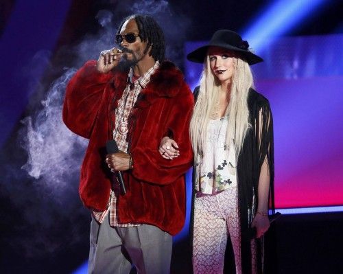 Snoop Lion and Ke$ha introduce a performance by Macklemore at the 2013 MTV Movie Awards in Culver City, California