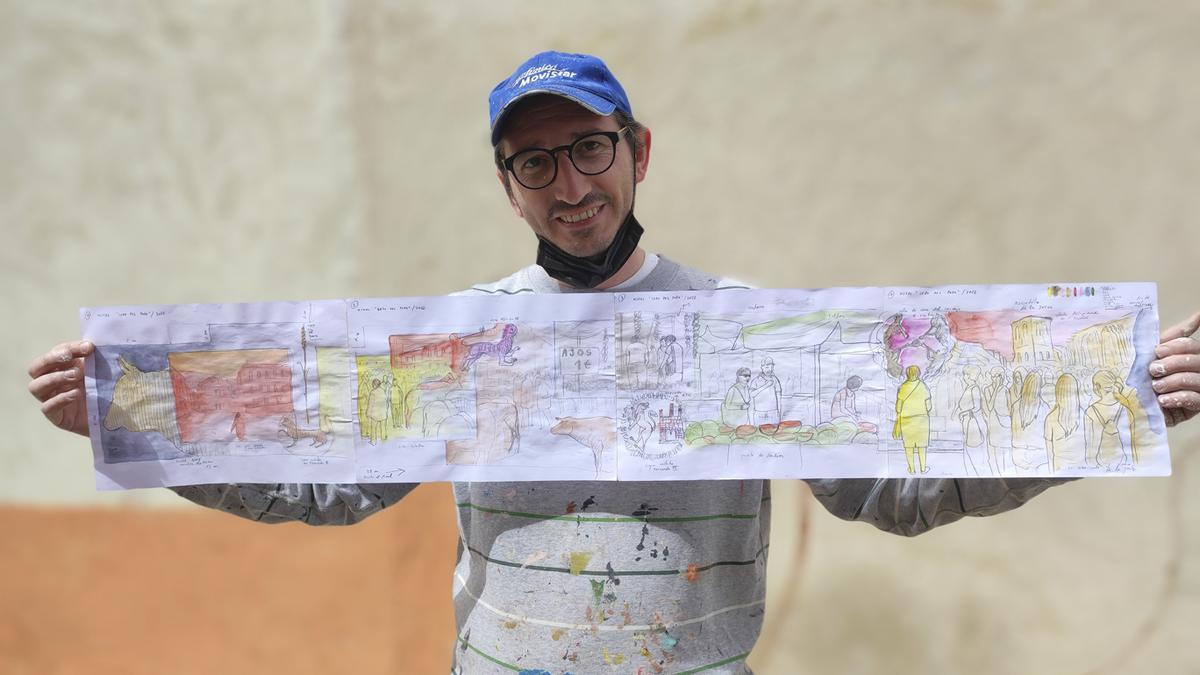 Antonio Féliz, &quot;Parsec&quot;, posando con el boceto que plasmará en la calle Ledo del Pozo, en el muro lateral de la Casa Consistorial de la Plaza del Grano.