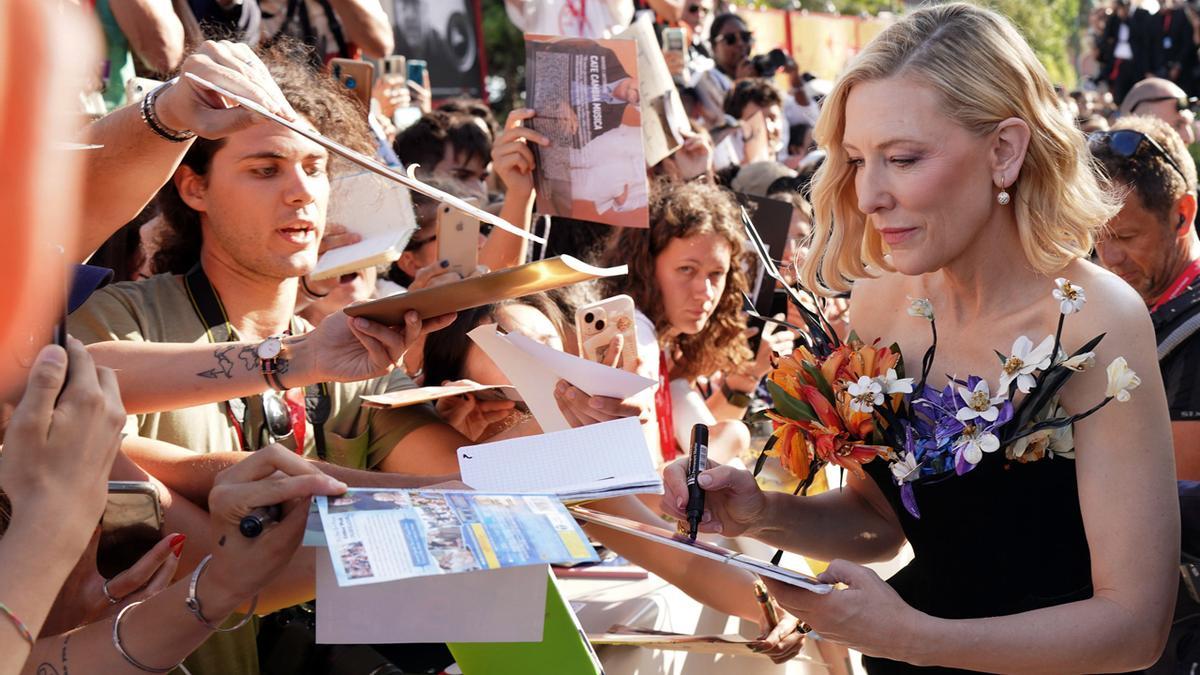 US actor Cate Blanchett signs autographs as she arrives for the premiere of 'Tar' during the 79th annual Venice International Film Festival, in Venice