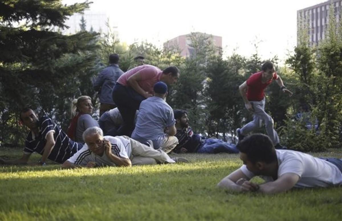 abertran34717073 people take cover as shots are fired in ankara  turkey july 160716103349