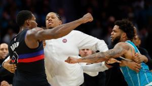 Detroit Pistons center Jalen Duren, left, throws punches with Charlotte Hornets forward Miles Bridges, right, during a fight on the court in the second half of an NBA basketball game in Charlotte, N.C., Monday, Feb. 9, 2026. (AP Photo/Nell Redmond)