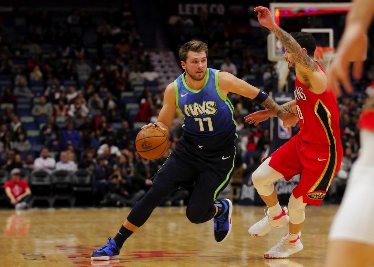 Dec 3, 2019; New Orleans, LA, USA; Dallas Mavericks forward Luka Doncic (77) drives past New Orleans Pelicans guard JJ Redick (4) during the first quarter at the Smoothie King Center. Mandatory Credit: Derick E. Hingle-USA TODAY Sports