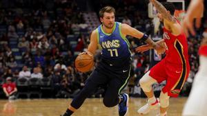 Dec 3, 2019; New Orleans, LA, USA; Dallas Mavericks forward Luka Doncic (77) drives past New Orleans Pelicans guard JJ Redick (4) during the first quarter at the Smoothie King Center. Mandatory Credit: Derick E. Hingle-USA TODAY Sports