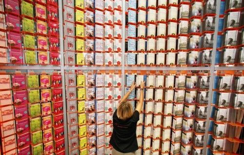 A woman sorts books at a booth during the preparations for the upcoming book fair in Frankfurt