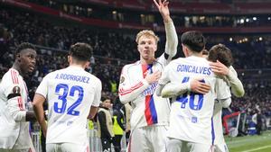 Lyons Adam Karabec, centre, celebrates with teammates after scoring his sides third goal during the Europa League soccer match between Lyon and PAOK in Lyon, France, Thursday, Jan. 29, 2026. (AP Photo/Laurent Cipriani)