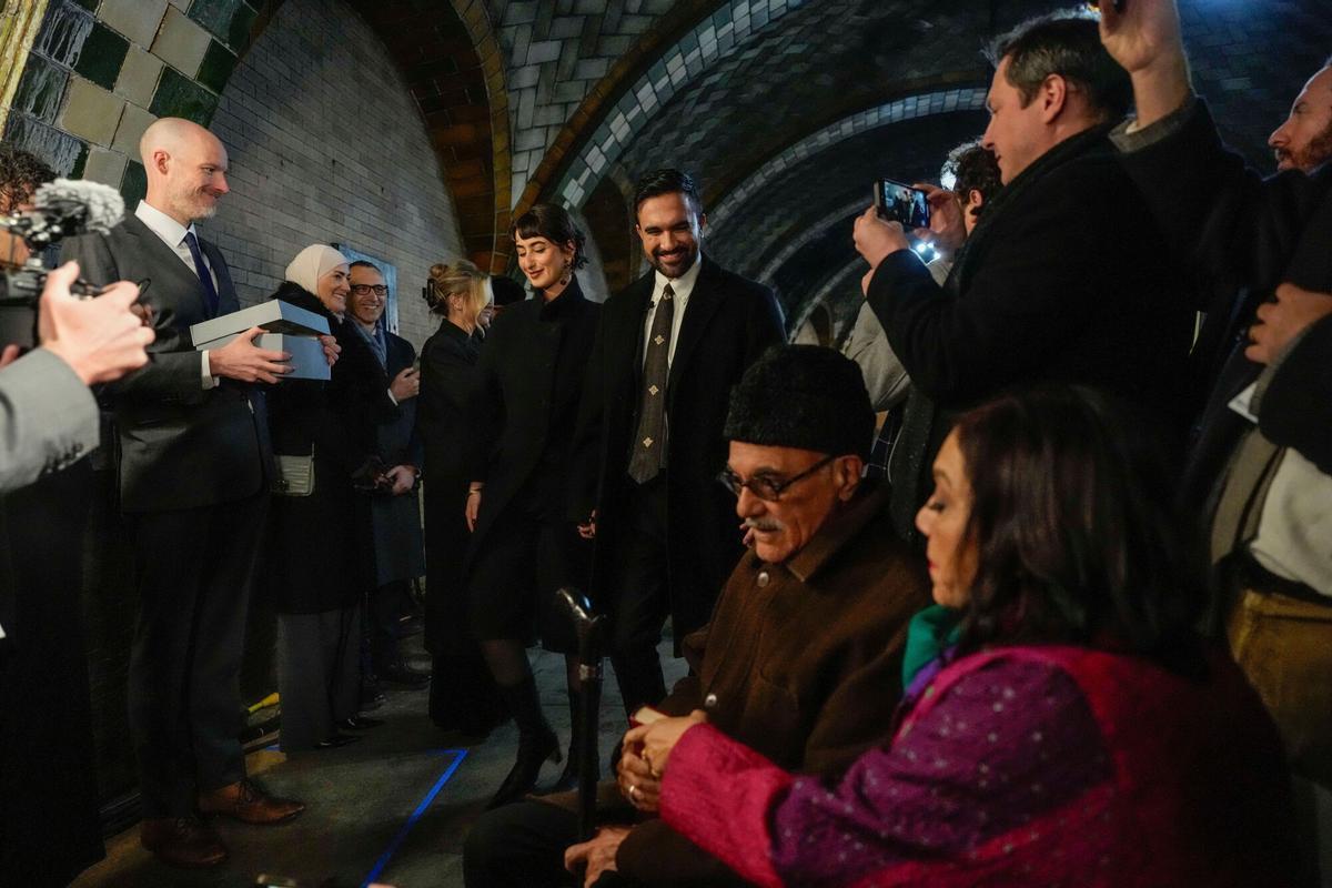 Mayor-elect Zohran Mamdani, center, arrives with his wife Rama Duwaji for a swearing-in ceremony as his parents Mira Nair, right, and Mahmood Mamdani, look on, Wednesday, Dec. 31, 2025, in New York. (AP Photo/Yuki Iwamura)