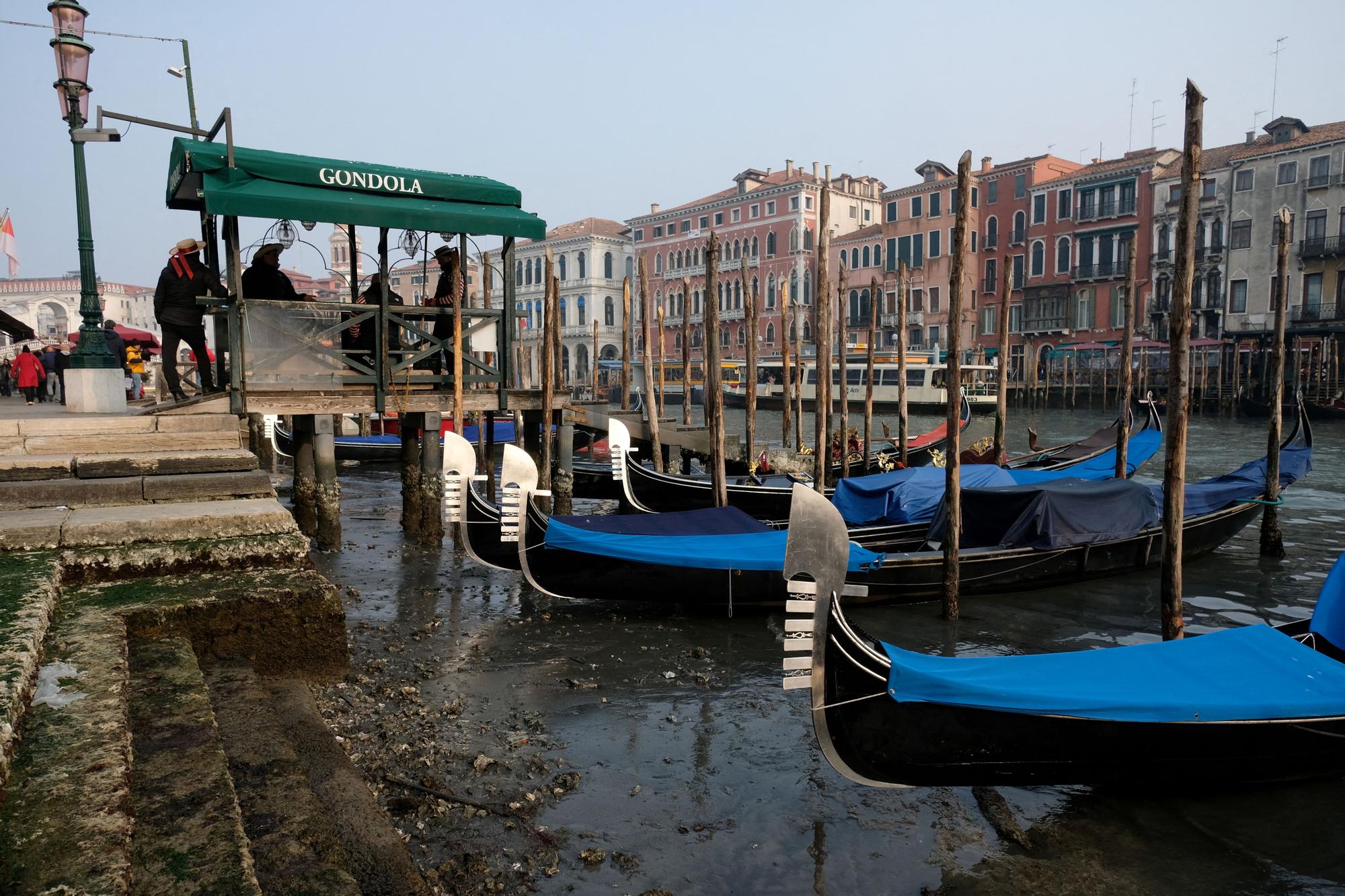 Gondolas are pictured in the Grand Canal during a severe low tide in the lagoon city of Venice