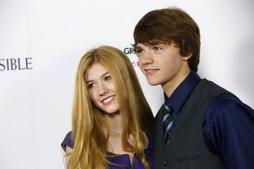 Katherine McNamara and Joel Courtney arrive at the premiere of the movie "The Impossible" in Hollywood