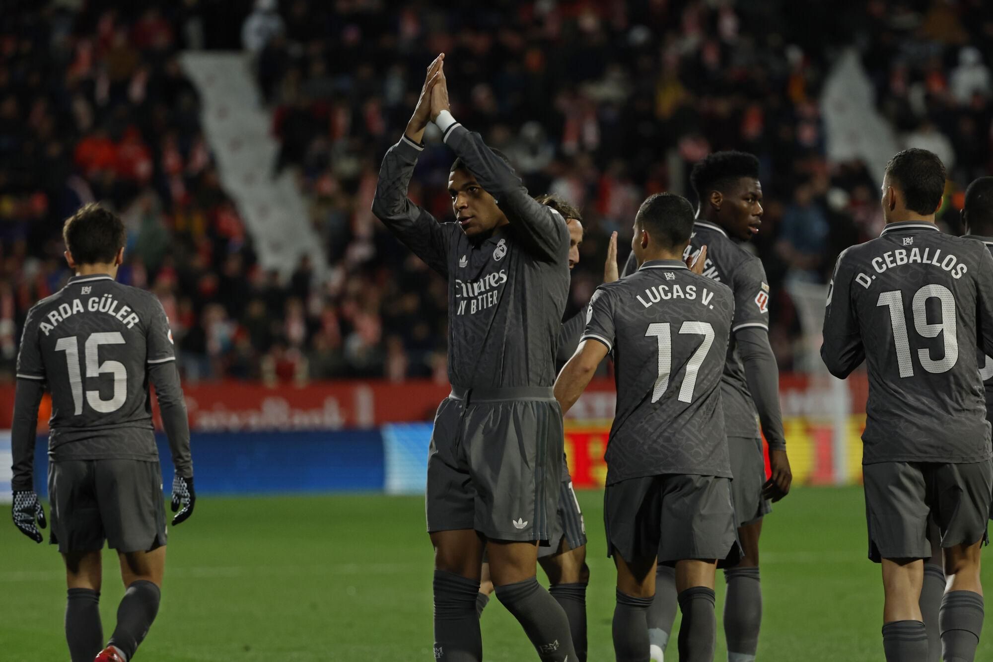Real Madrid's Kylian Mbappe. 2nd left, celebrates after scoring his side's third goal during a Spanish La Liga soccer match between Girona and Real Madrid at the Montilivi stadium in Girona, Spain, Saturday, Dec. 7, 2024. (AP Photo/Joan Monfort). EDITORIAL USE ONLY/ONLY ITALY AND SPAIN