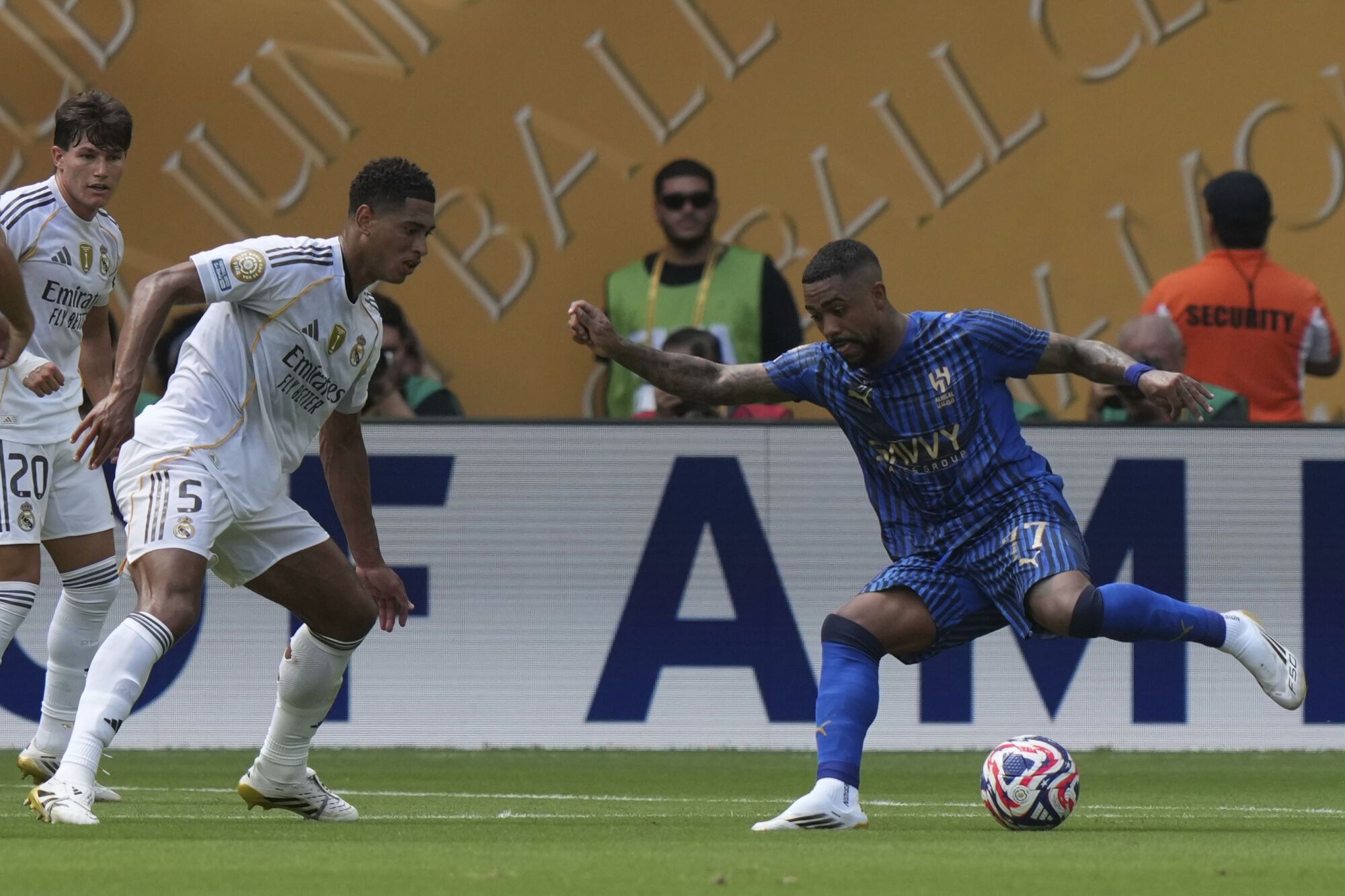 Al-Hilal's Mohammed Al-Rubaie, right, controls the ball as Real Madrid's Jude Bellingham defends during the Club World Cup group H soccer match between Real Madrid and Al Hilal in Miami, Fla., Wednesday, June 18, 2025. (AP Photo/Lynne Sladky). EDITORIAL USE ONLY/ONLY ITALY AND SPAIN