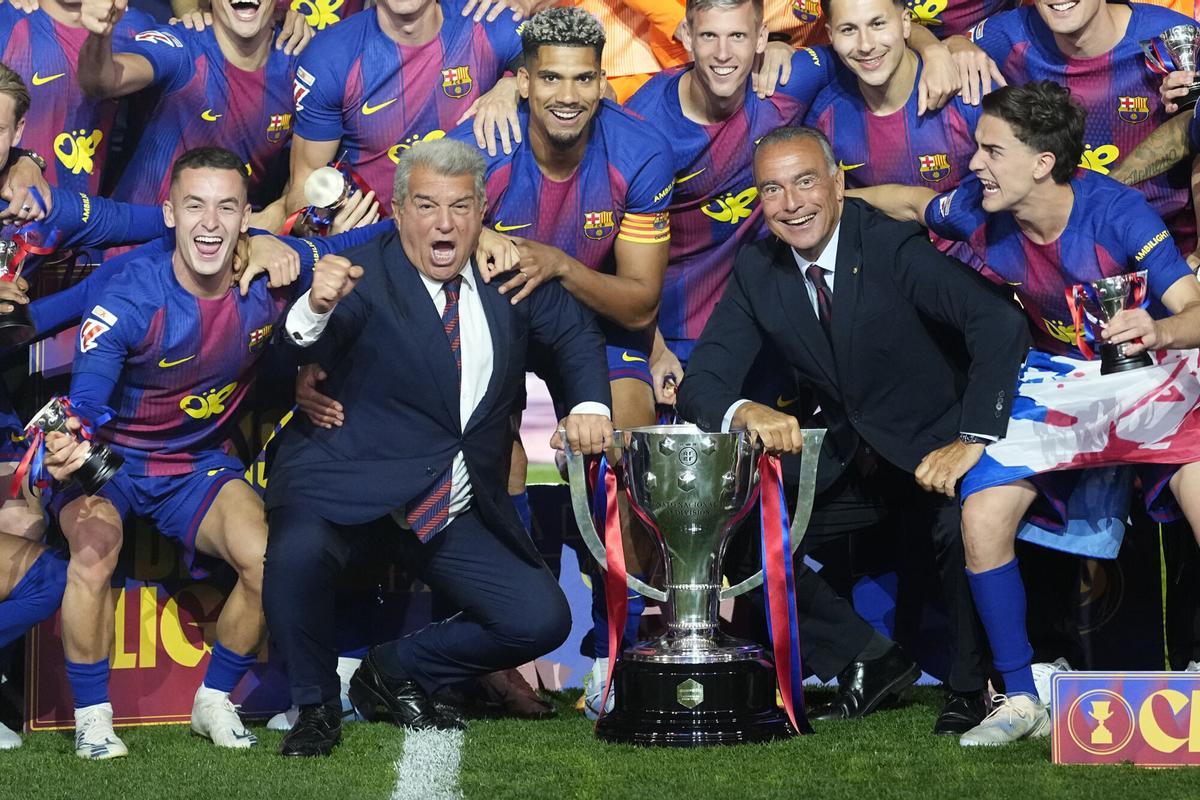 FC Barcelona's president Rafa Yuste (C-R), president-elect Joan Laporta (C-L) and players celebrate the Spanish LaLiga Championship with the Trophy at the end of the Spanish LaLiga soccer match between FC Barcelona and Real Madrid at Camp Nou stadium in Barcelona, Spain, 10 May 2026. EFE/Andreu Dalmau