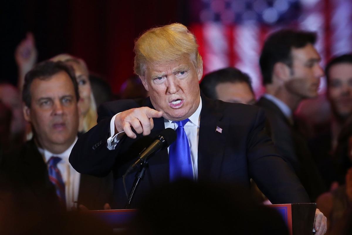 NEW YORK, NY - APRIL 26: Republican presidential candidate Donald Trump speaks to supporters and the media with New Jersey Governor Chris Christie behind him at Trump Towers following the conclusion of primaries Tuesday in northeastern states on April 26, 2016 in New York, New York. Trump again gained more delegates to move him closer to the Republican presidential nomination.   Spencer Platt/Getty Images/AFP