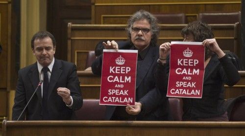 Deputies of ERC display banners against new government's education law during weekly cabinet control session at Parliament in Madrid