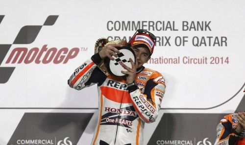 Honda MotoGP rider Marc Marquez of Spain celebrates on the podium after winning the Qatar MotoGP Grand Prix at the Losail International circuit in Doha