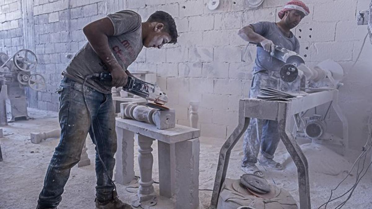 Nader 15 years old, modeling the famous rock from Arsal, working with dangerous machinery, child labour, syrian refugee, in Arsal, Bekaa Valley, Lebanon