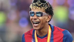 Barcelonas Spanish forward #10 Lamine Yamal celebrates after winning the Spanish Super Cup final football match between FC Barcelona and Real Madrid at the King Abdullah Stadium in Jeddah on January 11, 2026. (Photo by Fadel SENNA / AFP)