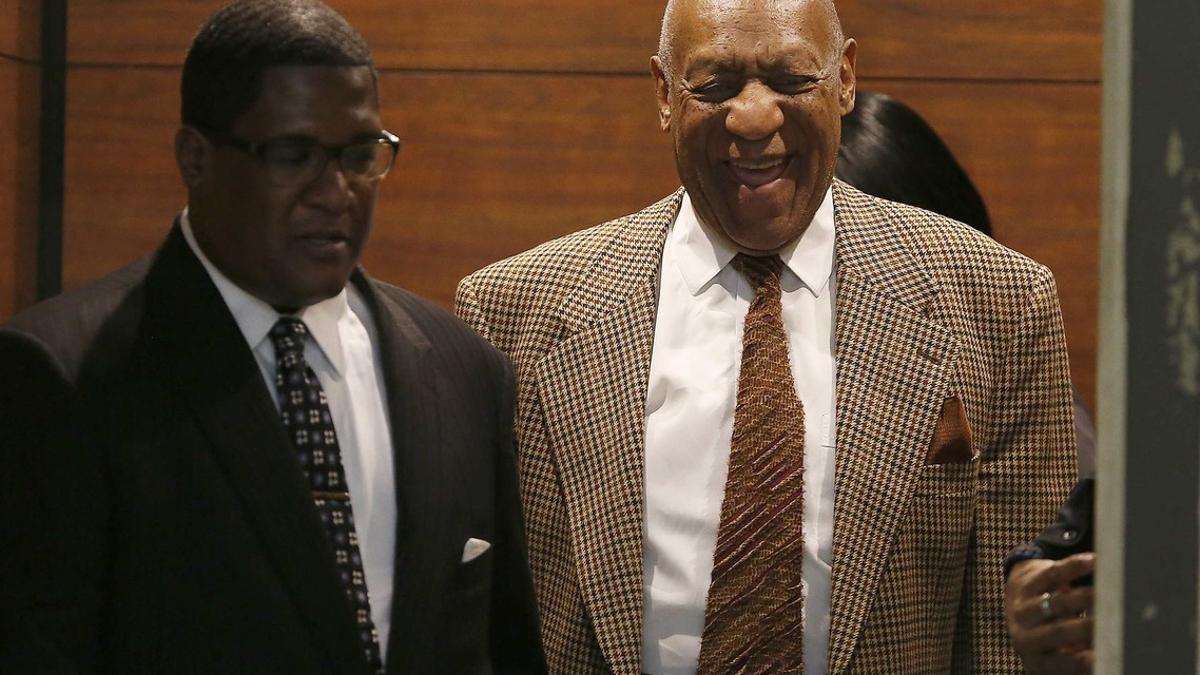 Cosby exits an elevator as he returns to court for a hearing in Norristown
