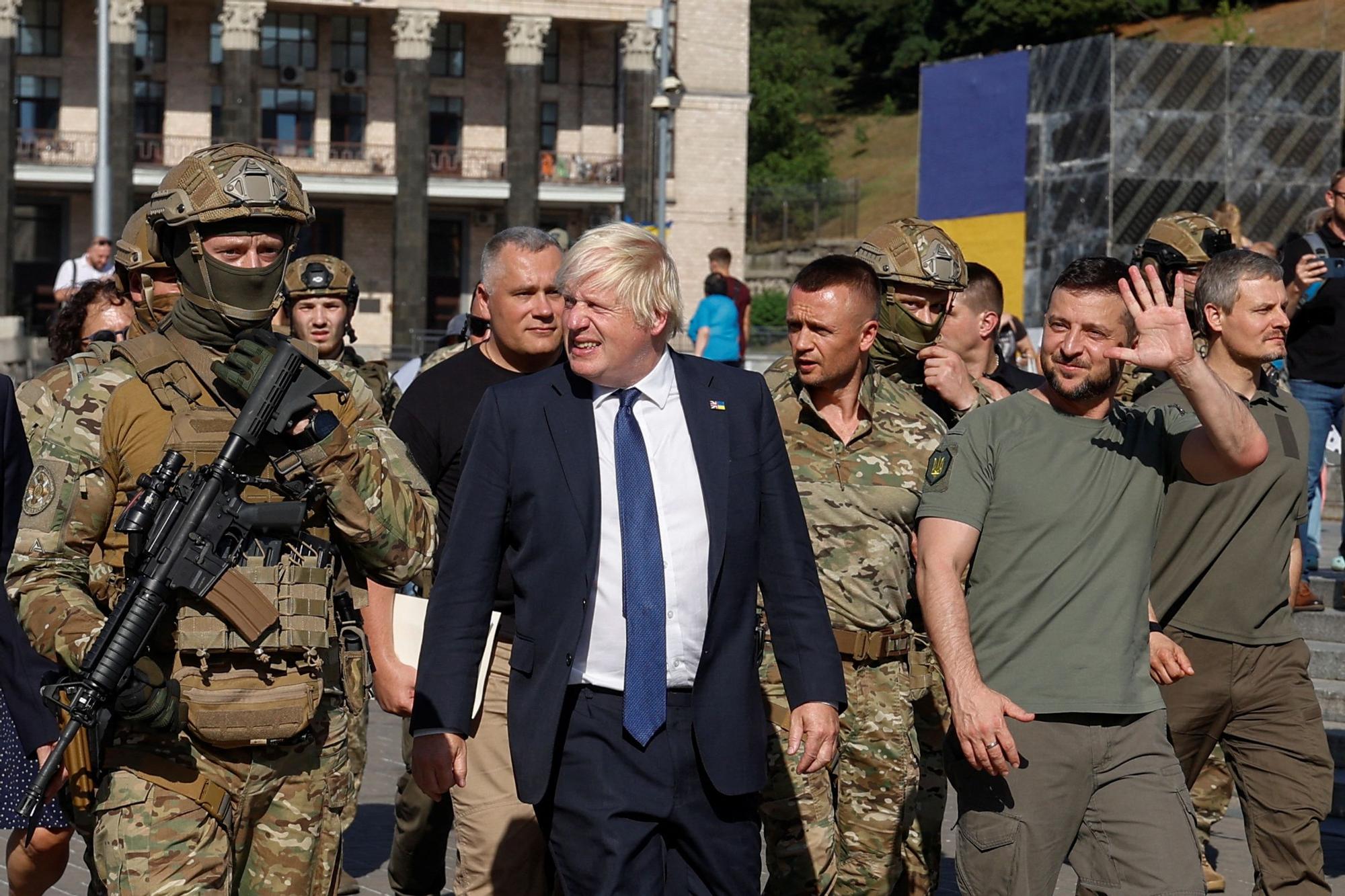 British PM Johnson and Ukrainian President Zelenskiy walk at the Independence Square in Kyiv