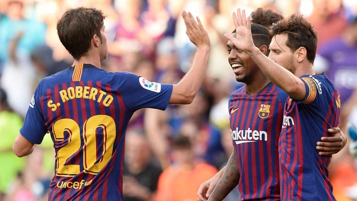 Sergi Roberto, Malcom y Messi celebran un gol del Barça en la temporada 2018/19