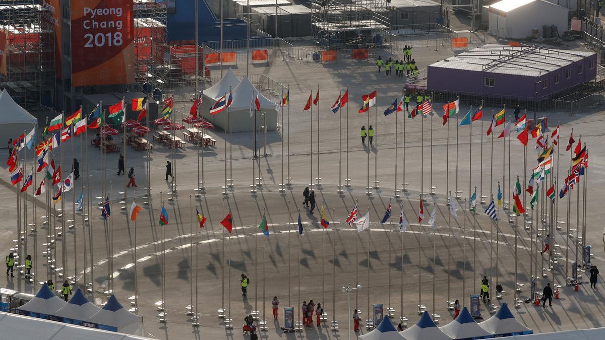 Flags of the participating countries of the Pyeongchang 2018 games fly on a square in Pyeongchang