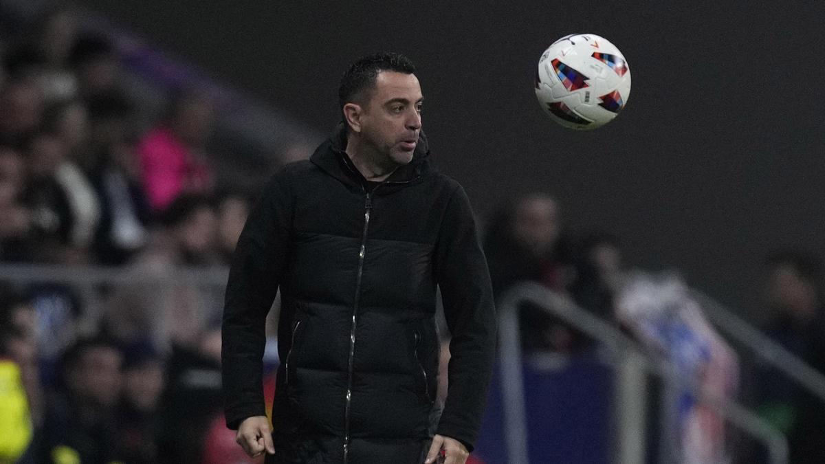 Xavi, durante el Atlético-Barça en el Metropolitano.