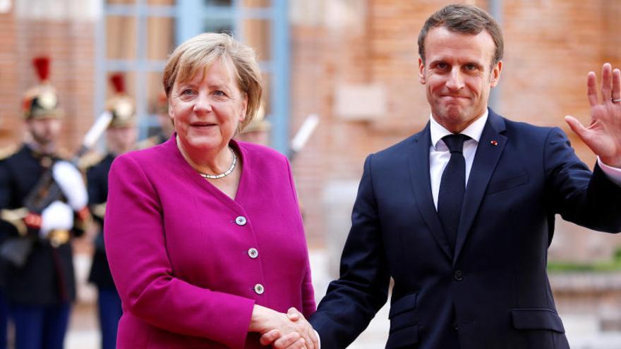 Merkel y Macron, este miércoles en Toulouse.