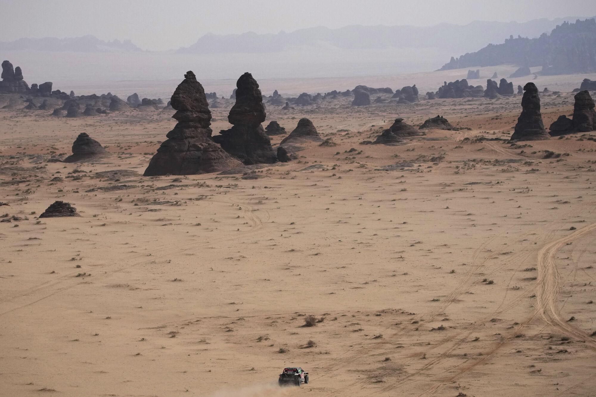 A car drives during the fifth stage of the Dakar Rally between Alula and Hail, Saudi Arabia, Thursday, Jan. 9, 2025. (AP Photo/Christophe Ena). EDITORIAL USE ONLY / ONLY ITALY AND SPAIN
