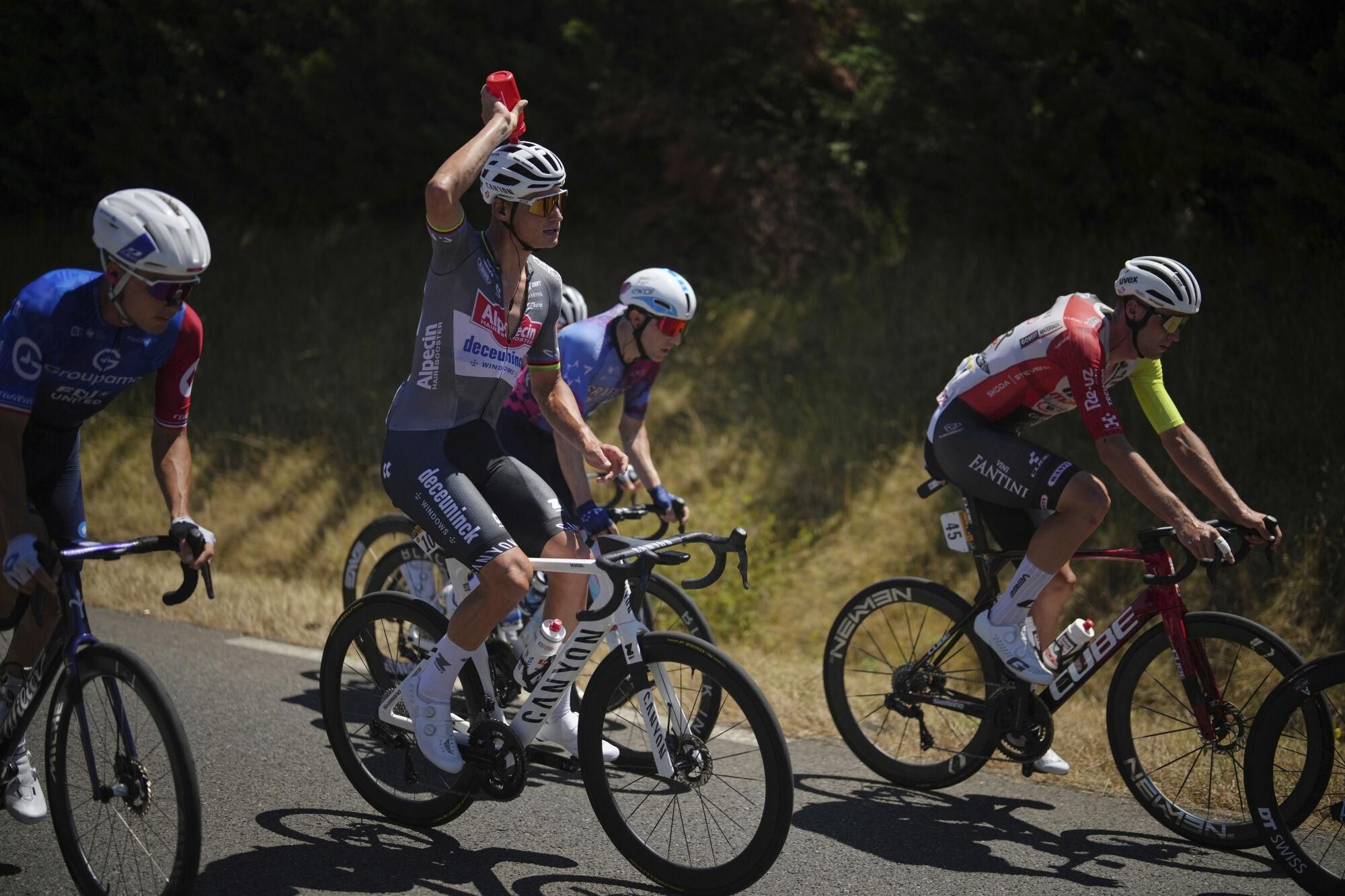 Netherlands' Mathieu van der Poel Colls off as he rides in the breakaway during the twelfth stage of the Tour de France cycling race over 180.6 kilometers (112.2 miles) with start in Auch and finish in Hautacam, France, Thursday, July 17, 2025. (AP Photo/Thibault Camus)