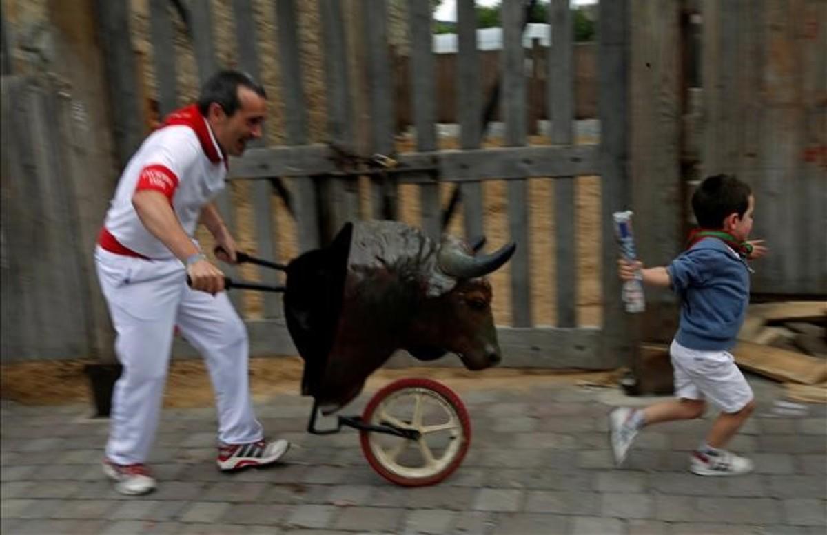 dcaminal34691727 a boy is chased by a toy bull as he takes part in the encier160714113814