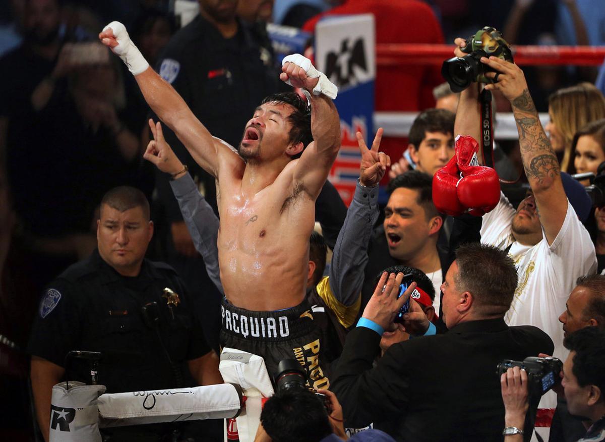 Manny Pacquiao of the Philippines celebrates his victory over Jessie Vargas of Las Vegas as he becomes WBO welterweight champion at the Thomas & Mack Center in Las Vegas, Nevada, U.S., November 5, 2016. REUTERS/Las Vegas Sun/L.E. Baskow