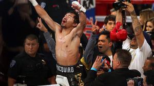 Manny Pacquiao of the Philippines celebrates his victory over Jessie Vargas of Las Vegas as he becomes WBO welterweight champion at the Thomas & Mack Center in Las Vegas, Nevada, U.S., November 5, 2016. REUTERS/Las Vegas Sun/L.E. Baskow