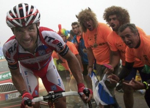 Spain's Rodriguez is cheered by supporters as he climbs L'Angliru port during the 142-km 20th stage of the Vuelta