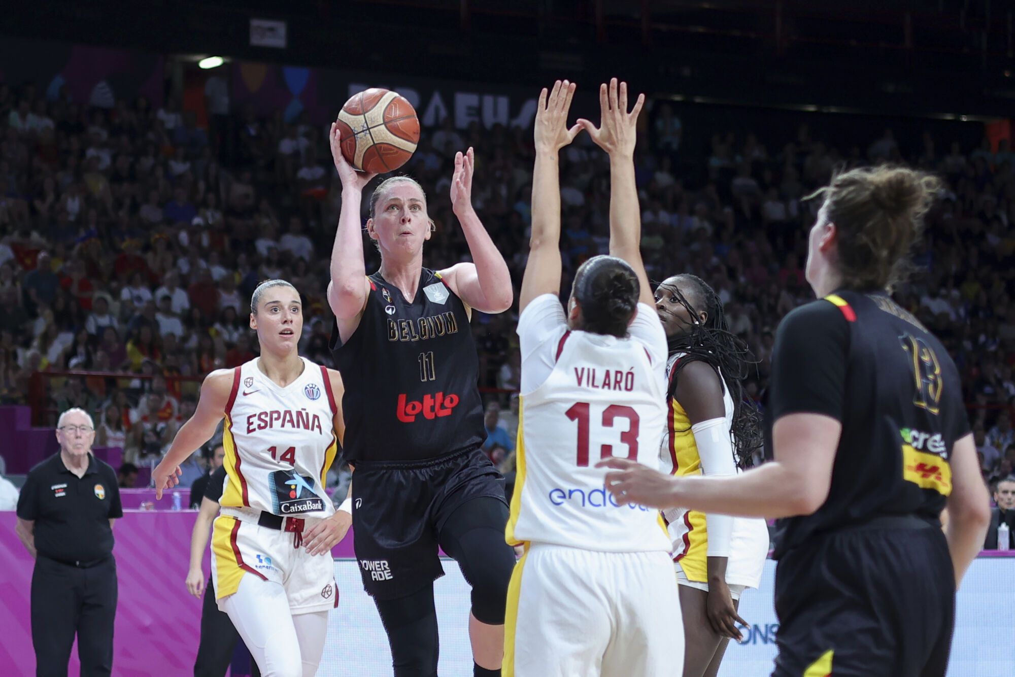 Belgium's Emma Meesseman, center, tries to score against Spain's Andrea Vilaro, during the FIBA Women's EuroBasket 2025 final match between Spain and Belgium at the Peace and Friendship Stadium in Piraeus near Athens, Greece, Sunday, June 29, 2025. (AP Photo/Yorgos Karahalis)