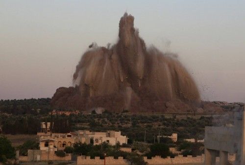 Debris rises during what rebel fighters said was an operation in which they blew up a tunnel targeting the regime's al-Sawadi checkpoint, in Idlib province