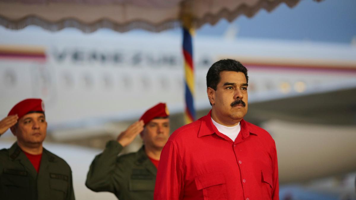 Venezuela's President Nicolas Maduro receives military honors at Maiquetia airport, in Caracas