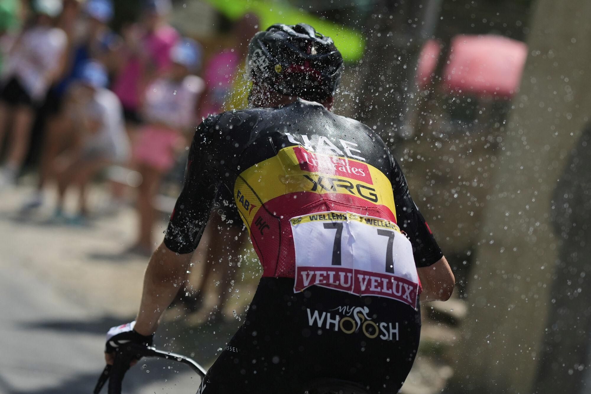 Belgium's Tim Wellens cools off with his drinking bottle during the fifteenth stage of the Tour de France cycling race over 169.3 kilometers (105.2 miles) with start in Muret and finish in Carcassone, France, Sunday, July 20, 2025. (AP Photo/Mosa'ab Elshamy)